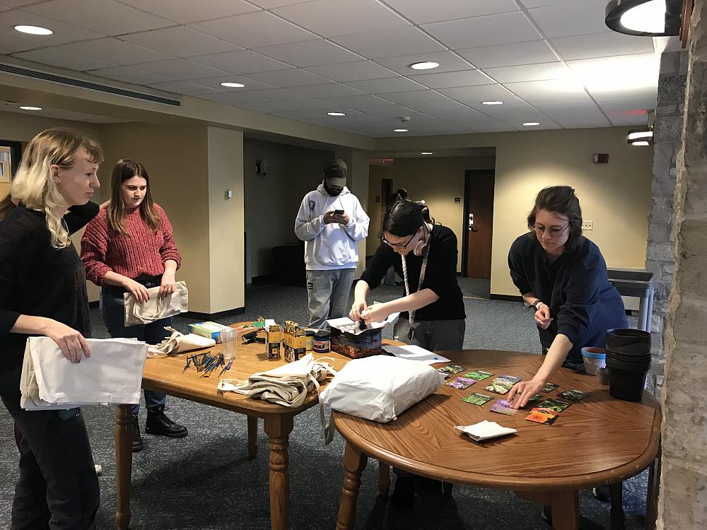 Students select seeds to plant.